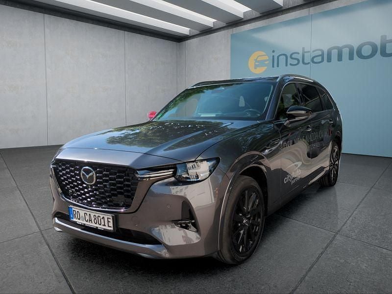 Grau Gebraucht 2024 Mazda CX-80 Homura-Line SUV | 53.149 € (Teuer) - Bild 1/4