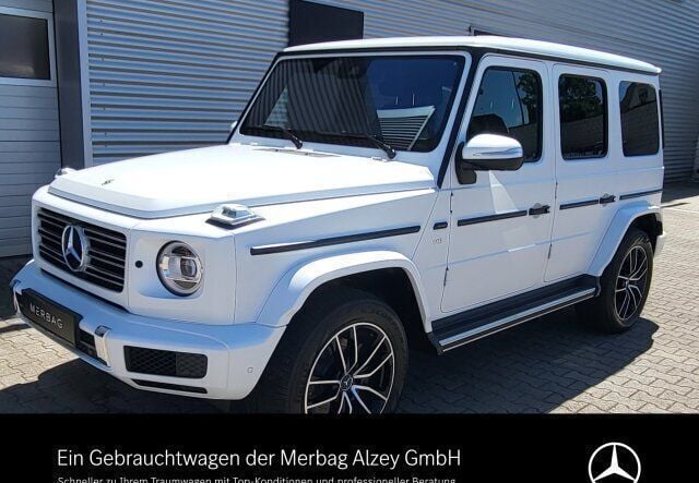 G manufaktur opalithweiss magno Gebraucht 2024 Mercedes G500 AMG line SUV | 152.490 € (Superpreis) - Bild 1/4