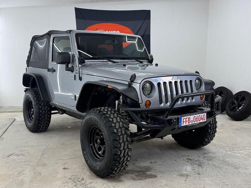 Grau Gebraucht 2013 Jeep Wrangler Sahara SUV | 25.900 € (Superpreis) - Bild 1/4