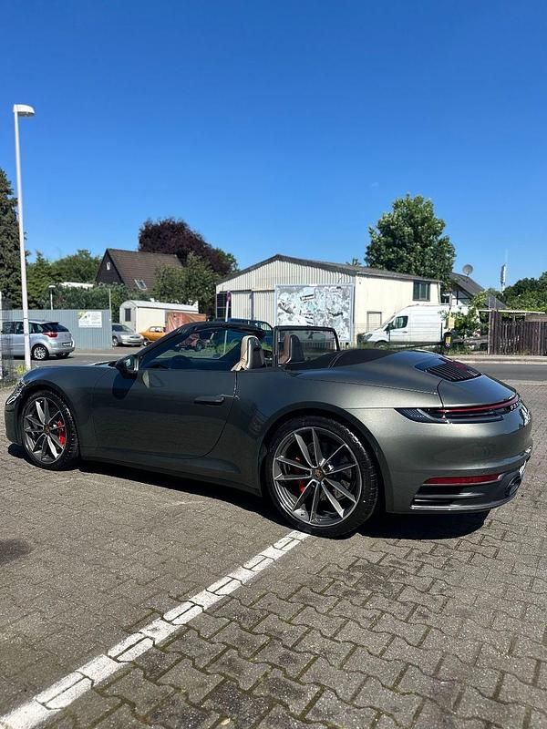 Grün Gebraucht 2024 Porsche 911 Carrera S Cabriolet Cabrio | 152.000 € (Fairer Preis) - Bild 1/4