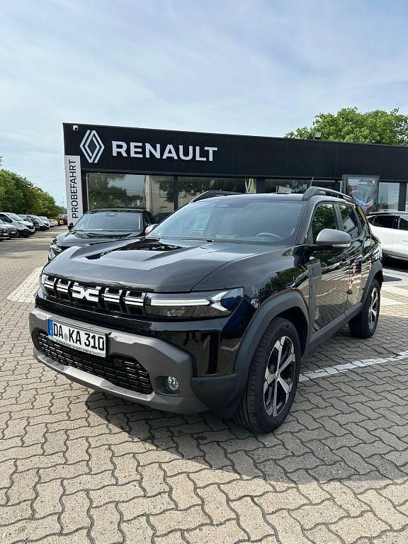 Schwarz (perlmuttschwarzmetallic) Gebraucht 2024 Dacia Duster Journey SUV | 24.590 € (Fairer Preis) - Bild 1/4