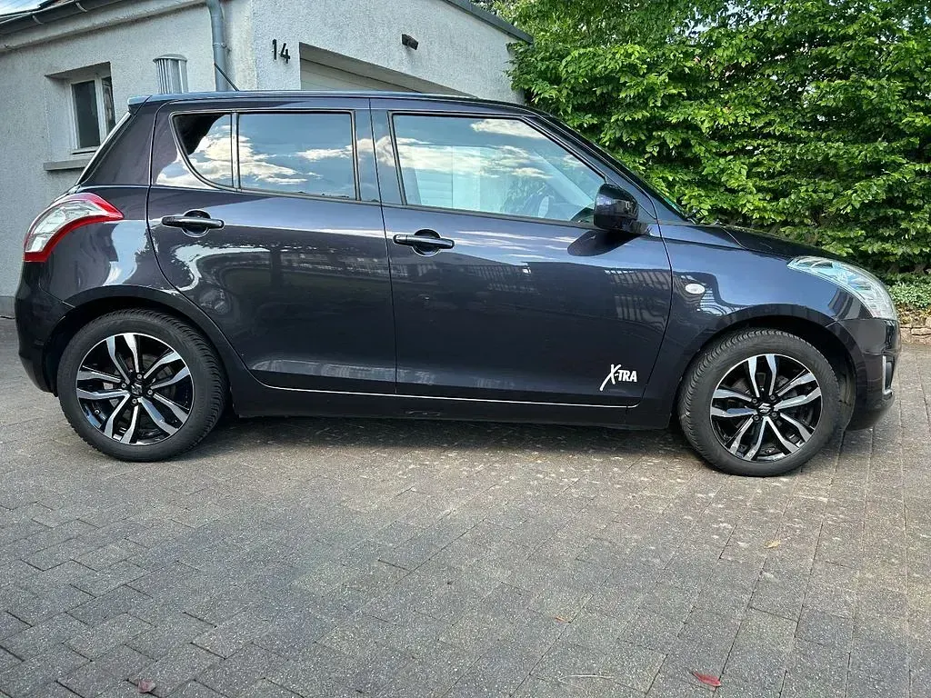 Gebraucht Suzuki Swift X-TRA 94 PS (69 kW) 2015 Grau Kleinwagen