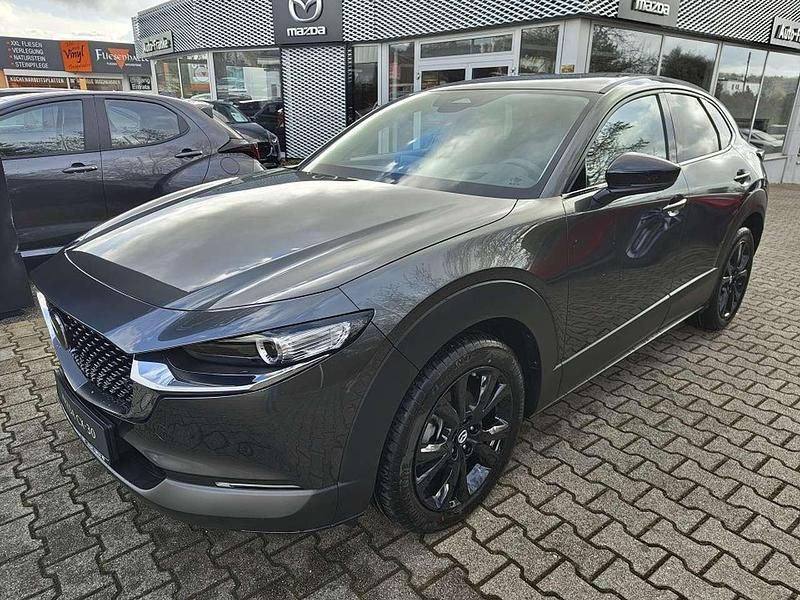 Machine gray Neu 2025 Mazda CX-30 Homura-Line SUV | 29.990 € - Bild 1/4