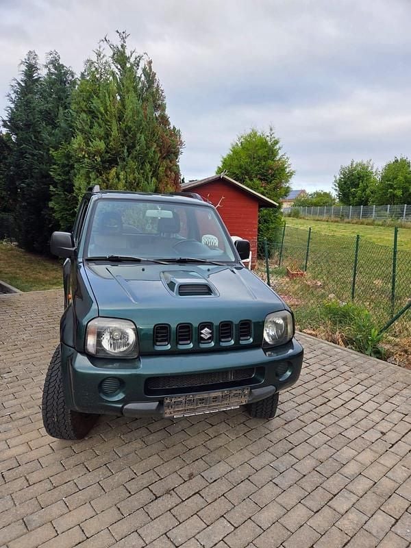 Grün Gebraucht 2005 Suzuki Jimny SUV | 2.500 € (Superpreis) - Bild 1/4
