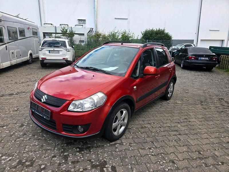 Orange Gebraucht 2006 Suzuki SX4 Kleinwagen | 4.250 € (Fairer Preis) - Bild 1/4