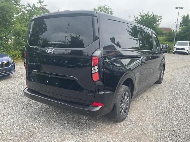 Agate black metallic agate black metallic Neu 2025 Ford Tourneo Custom Titanium Van / Kleinbus | 55.400 € (Guter Preis) - Bild 1/4
