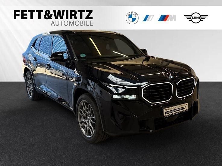Carbonschwarz metallic Gebraucht 2024 BMW XM Comfort Edition SUV | 99.800 € - Bild 1/3