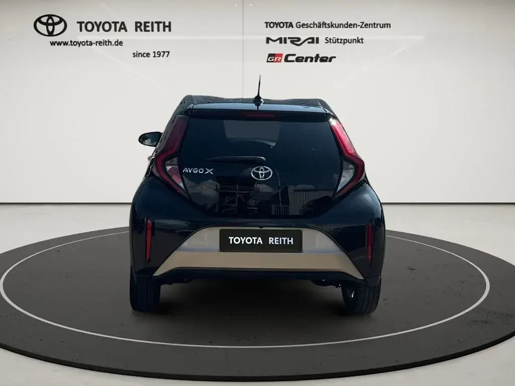 Gebraucht Toyota Aygo X Pulse 72 PS (52 kW) 2022 Ginger beige (4u9)/ black mica SUV