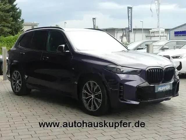 Gebraucht BMW X5 Performance 489 PS (359 kW) 2024 Sonderlack techno violett SUV