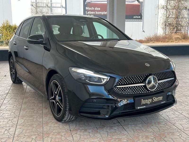 Gebraucht Mercedes B250e AMG line 218 PS (160 kW) 2024 Metalliclack kosmosschwarz Van / Kleinbus