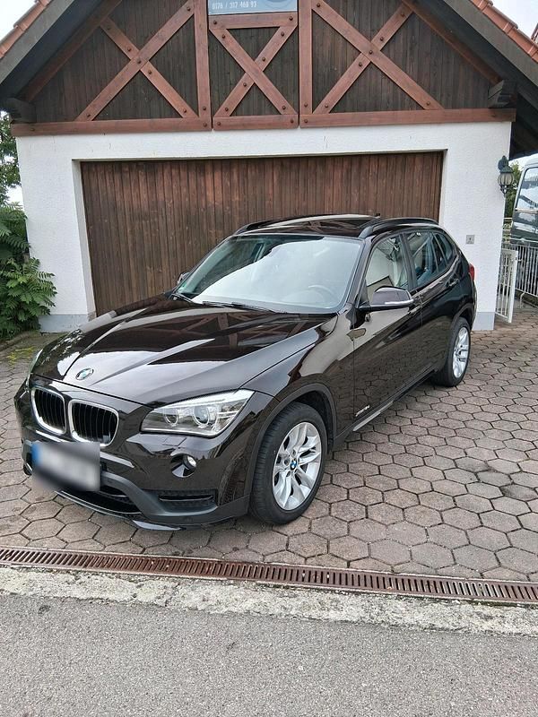Braun Gebraucht 2014 BMW X1 Sport Line SUV | 12.899 € - Bild 1/4