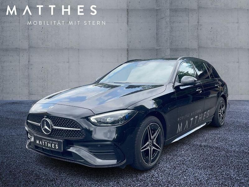 Obsidianschwarz schwarz Gebraucht 2023 Mercedes C300e AMG Kombi | 43.232 € (Fairer Preis) - Bild 1/4