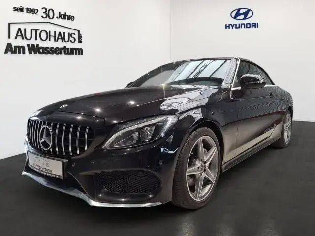 Obsidianschwarz metalliclack Gebraucht 2018 Mercedes C180 AMG line Cabrio | 27.999 € (Fairer Preis) - Bild 1/4