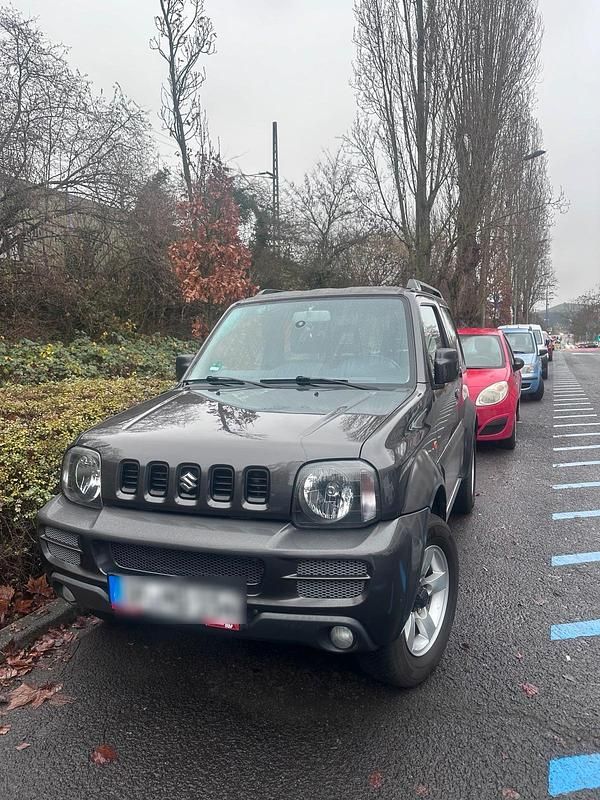 Grau Gebraucht 2014 Suzuki Jimny SUV | 14.450 € (Teuer) - Bild 1/4