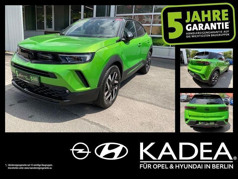 Lackierung matcha green/typ au Gebraucht 2024 Opel Mokka SUV | 21.450 € (Superpreis) - Bild 1/4