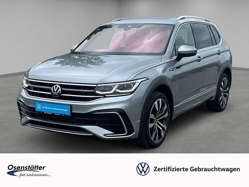 Silber Gebraucht 2024 VW Tiguan Allspace R-line SUV | 51.980 € - Bild 1/4