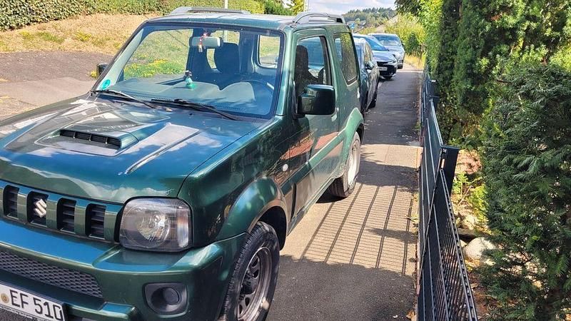 Grün Gebraucht 2014 Suzuki Jimny Club SUV | 12.850 € (Fairer Preis) - Bild 1/1