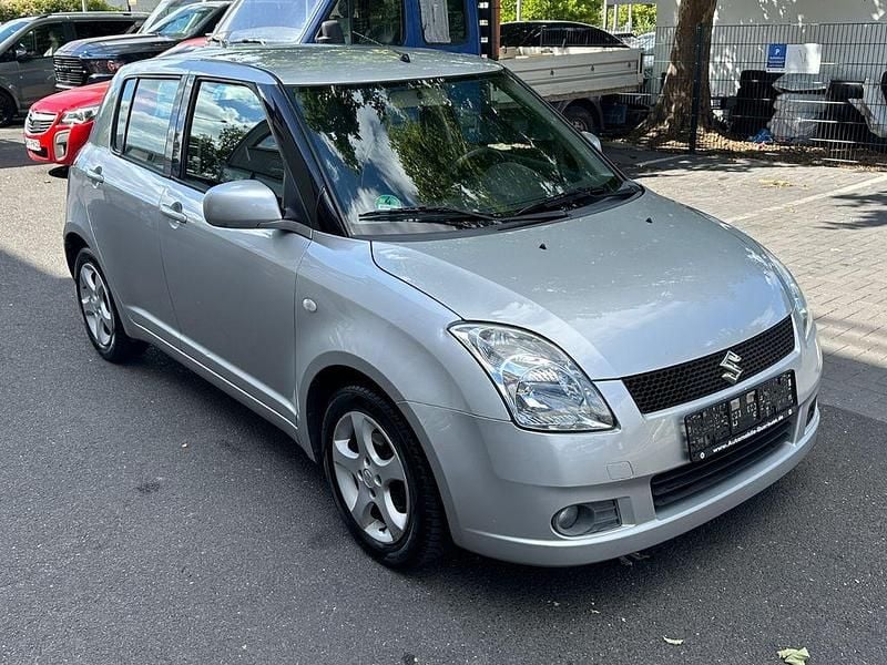 Grau Gebraucht 2007 Suzuki Swift Snow Limousine | 4.999 € (Etwas zu teuer) - Bild 1/4