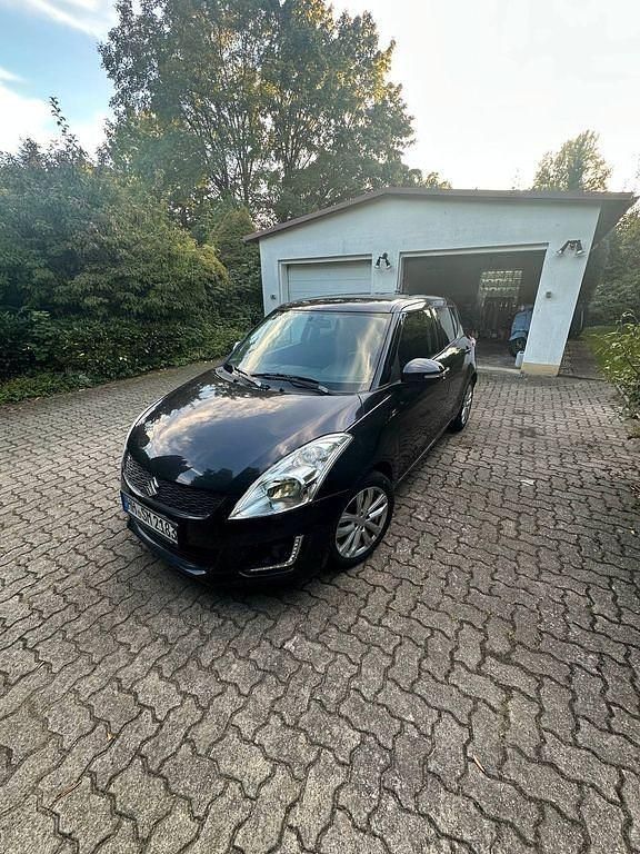 Grau Gebraucht 2014 Suzuki Swift Comfort Limousine | 6.800 € - Bild 1/4