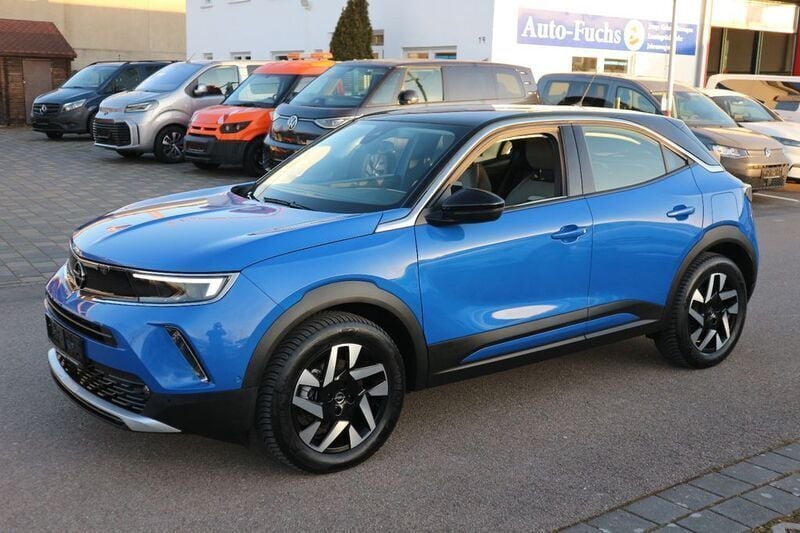 Perl blau/voltaik blau Gebraucht 2022 Opel Mokka-e Elegance SUV | 17.999 € (Guter Preis) - Bild 1/4