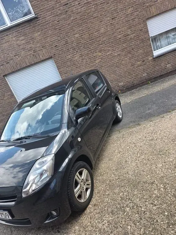Gebraucht Daihatsu Sirion 91 PS (66 kW) 2008 Schwarz Kleinwagen