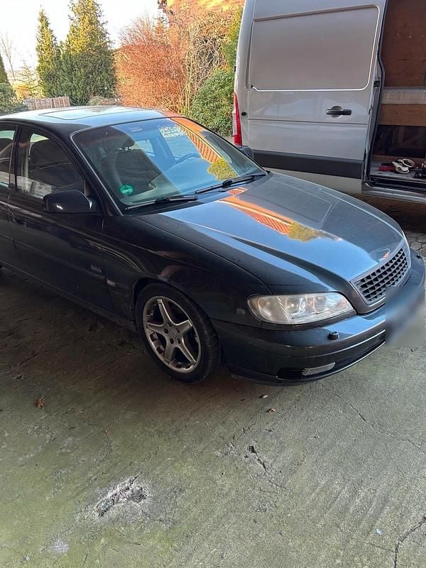 Second-hand Opel Omega 170 CP (125 kW) 2000 Negru Berlinǎ