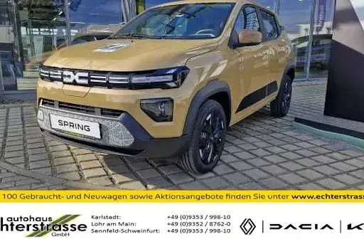 Używany Dacia Spring Extreme 75 kW (102 KM) 2025 Beżowy Hatchback