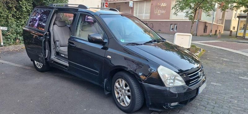 Schwarz Gebraucht 2006 Kia Carnival Van / Kleinbus | 2.250 € (Fairer Preis) - Bild 1/4