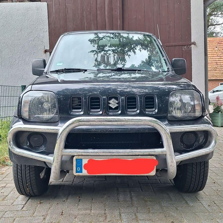Schwarz Gebraucht 2005 Suzuki Jimny SUV | 7.000 € (Fairer Preis) - Bild 1/4