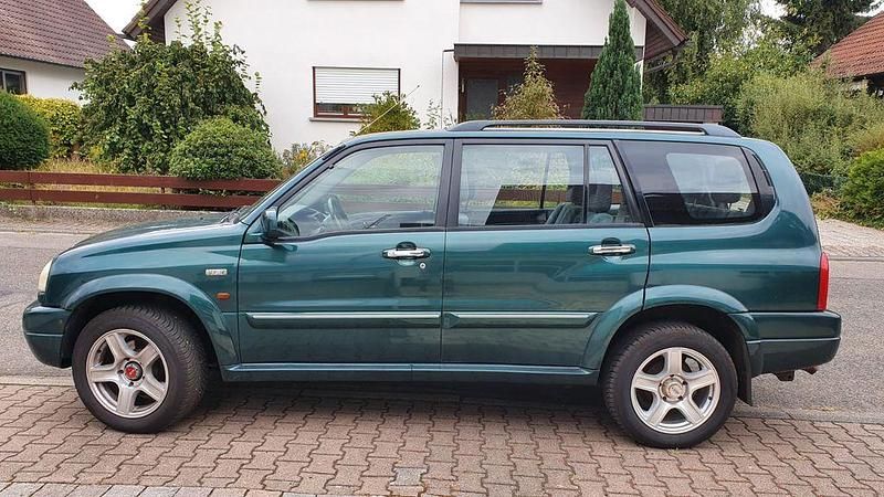 Grün Gebraucht 2002 Suzuki Grand Vitara Comfort SUV | 4.999 € - Bild 1/4