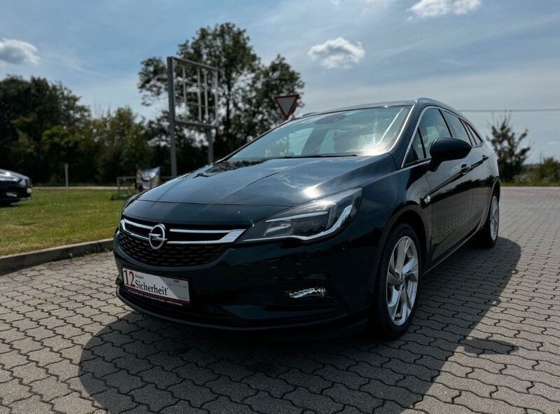Grün Gebraucht 2017 Opel Astra Dynamic Kombi | 10.999 € (Fairer Preis) - Bild 1/4