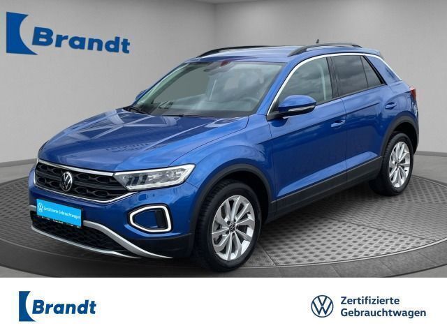 Ravennablau metallic (metallic) Gebraucht 2024 VW T-Roc Life SUV | 23.990 € (Superpreis) - Bild 1/1