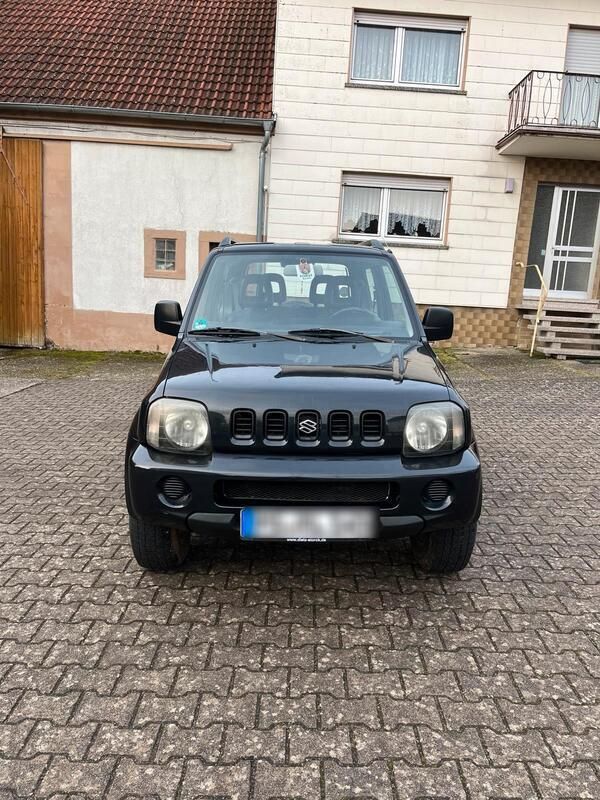 Schwarz Gebraucht 2004 Suzuki Jimny SUV | 5.800 € (Fairer Preis) - Bild 1/4