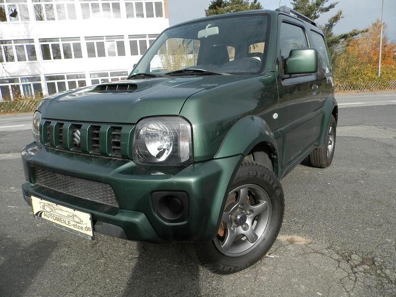 Grün Gebraucht 2013 Suzuki Jimny SUV | 12.790 € (Etwas zu teuer) - Bild 1/4