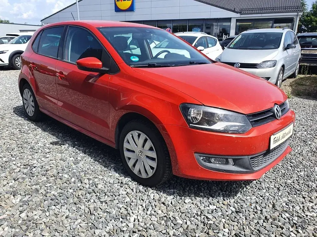 Gebraucht VW Polo Team 69 PS (50 kW) 2010 Hot orange metallic Kleinwagen