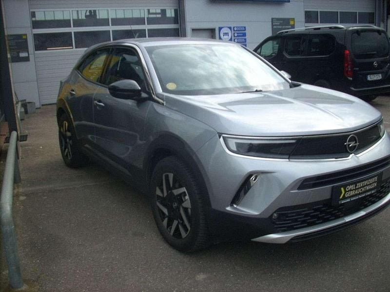 Gebraucht Opel Mokka-e Elegance 100 kW (136 PS) 2022 Kontrast grau/quarz silber SUV