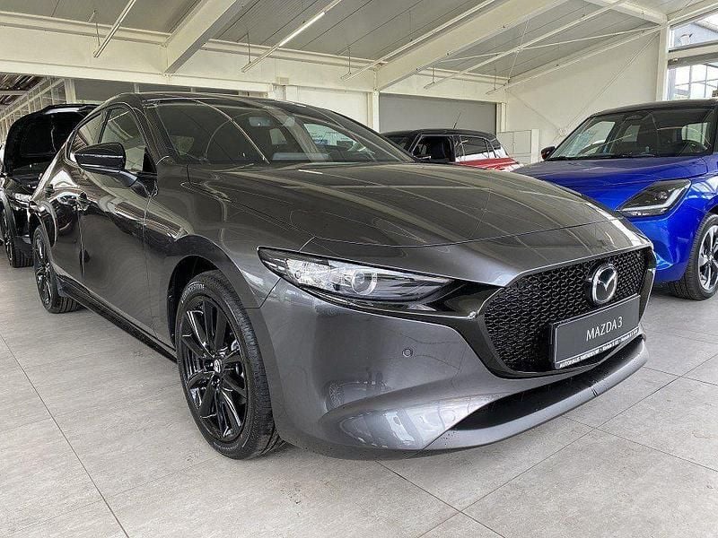 Machine gray Gebraucht 2025 Mazda 3 Homura-Line Kleinwagen | 29.800 € (Fairer Preis) - Bild 1/4