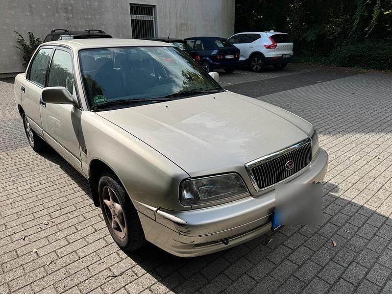 Gold Gebraucht 1998 Daihatsu Applause Limousine | 1.500 € - Bild 1/4