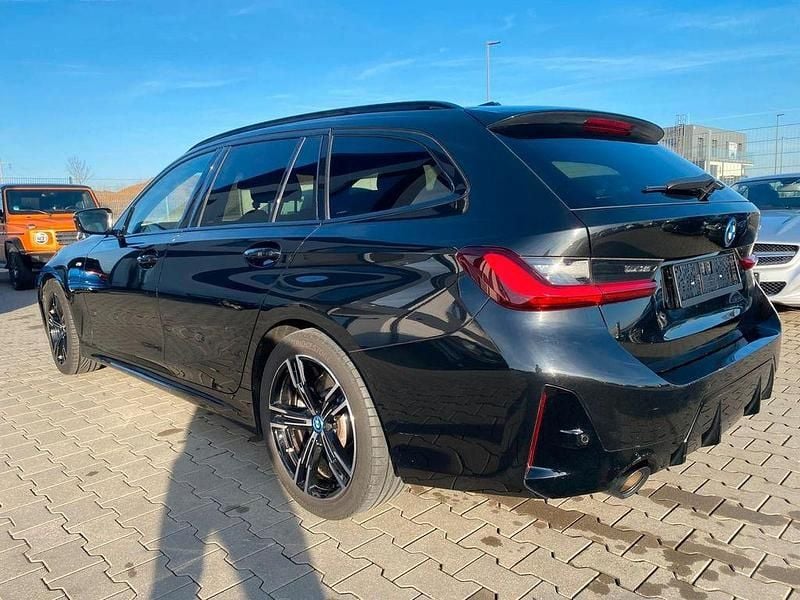 Gebraucht BMW 320e M Sport 204 PS (150 kW) 2024 Schwarz Kombi