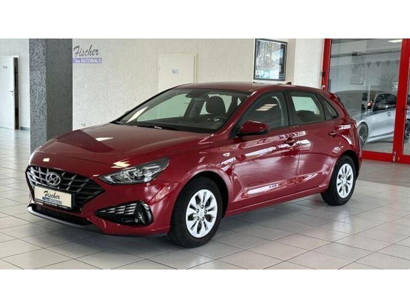 Sunset red (metallic) Gebraucht 2021 Hyundai i30 Limousine | 15.990 € (Fairer Preis) - Bild 1/4