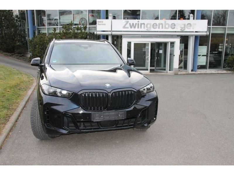 Carbonschwarz metallic (metallic) Gebraucht 2024 BMW X5 Comfort Edition SUV | 79.998 € - Bild 1/4