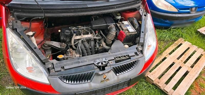 Second-hand Mitsubishi Colt 75 CP (55 kW) 2007 Roșu Hatchback