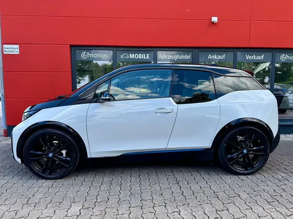 Gebraucht BMW i3 135 kW (184 PS) 2022 Capparisweiß mit bmw i blau Kleinwagen
