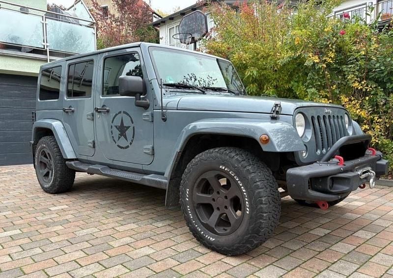 Grau Gebraucht 2015 Jeep Wrangler Sahara SUV | 27.850 € (Superpreis) - Bild 1/4