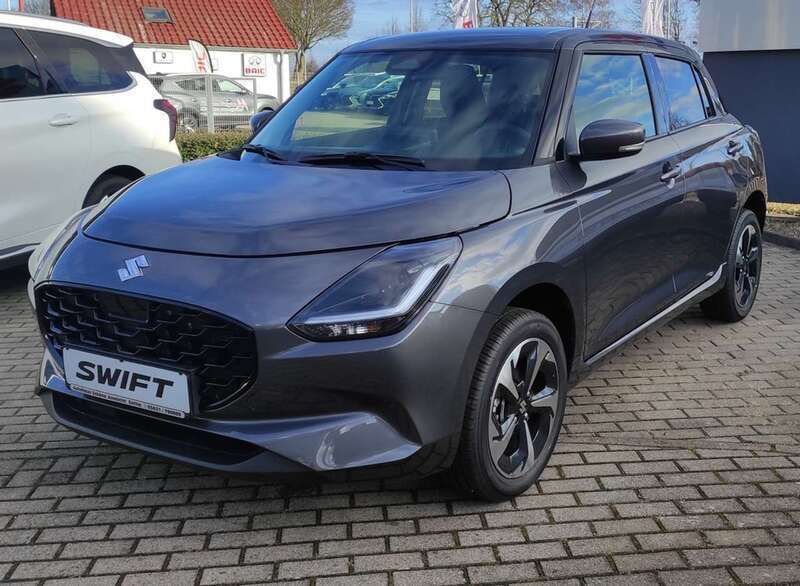Grau (mineral gray metallic) Neu 2025 Suzuki Swift Comfort+ Kleinwagen | 23.515 € - Bild 1/4