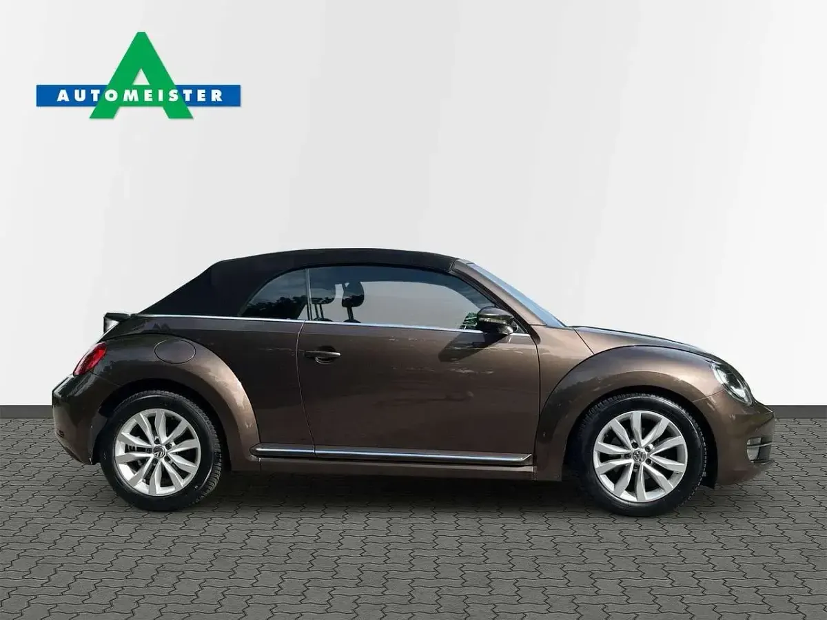 Używany VW Beetle Cabriolet Design 105 KM (77 kW) 2013 Brązowy Kabriolet