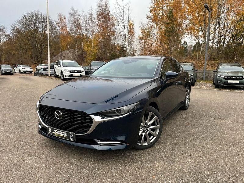 Deep crystal blue Neu 2025 Mazda 3 Exclusive-Line Limousine | 32.490 € - Bild 1/4