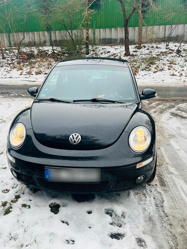 Gebraucht VW New Beetle 102 PS (75 kW) 2010 Schwarz Kleinwagen