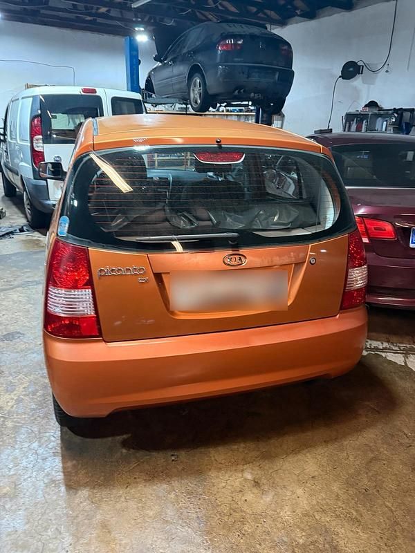 Second-hand Kia Picanto 65 CP (47 kW) 2006 Portocaliu Hatchback