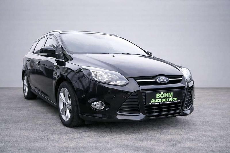 Gebraucht Ford Focus Champions Edition 125 PS (91 kW) 2013 Pantherschwarz metallic Kombi